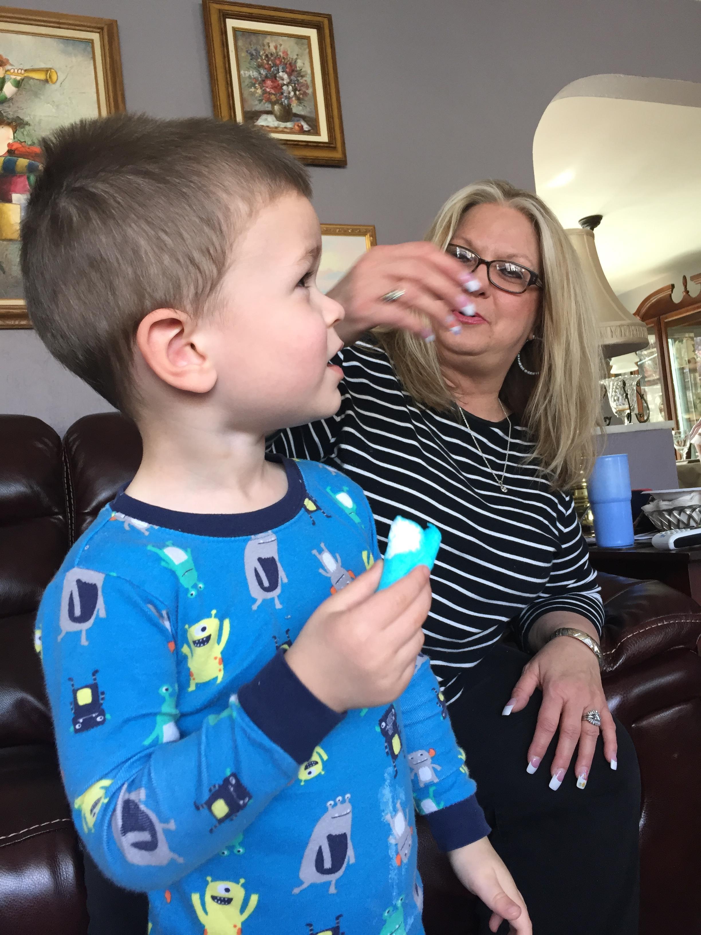 A woman feeding a child