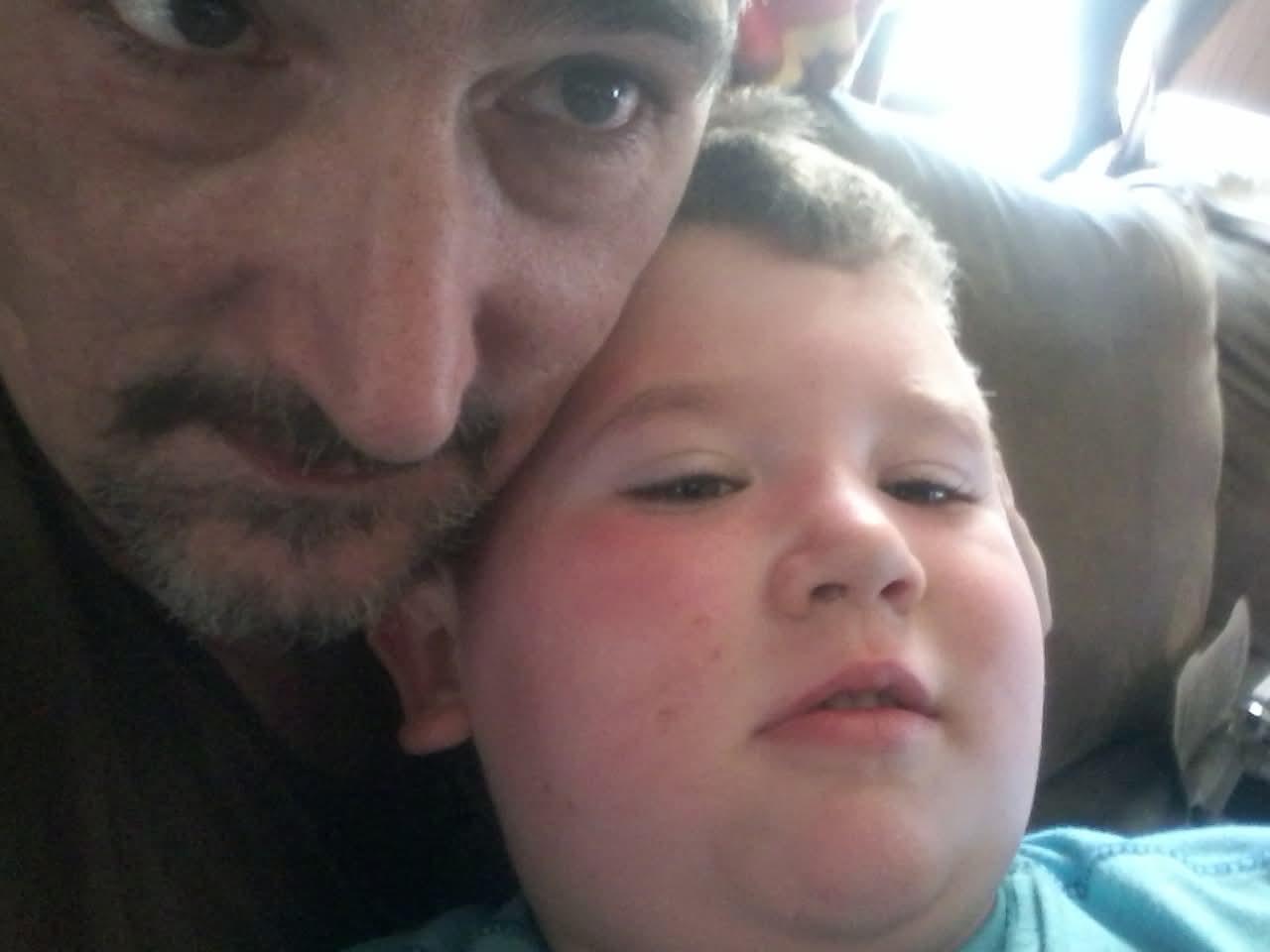 A man and child taking a selfie
