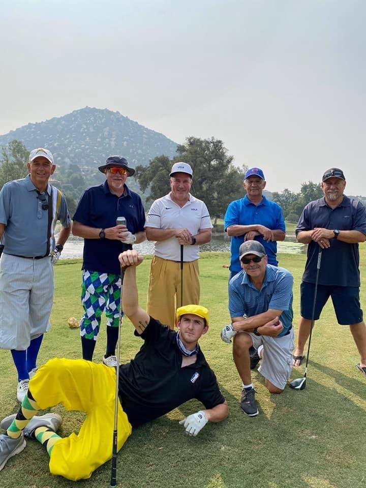 A group of men posing for a picture