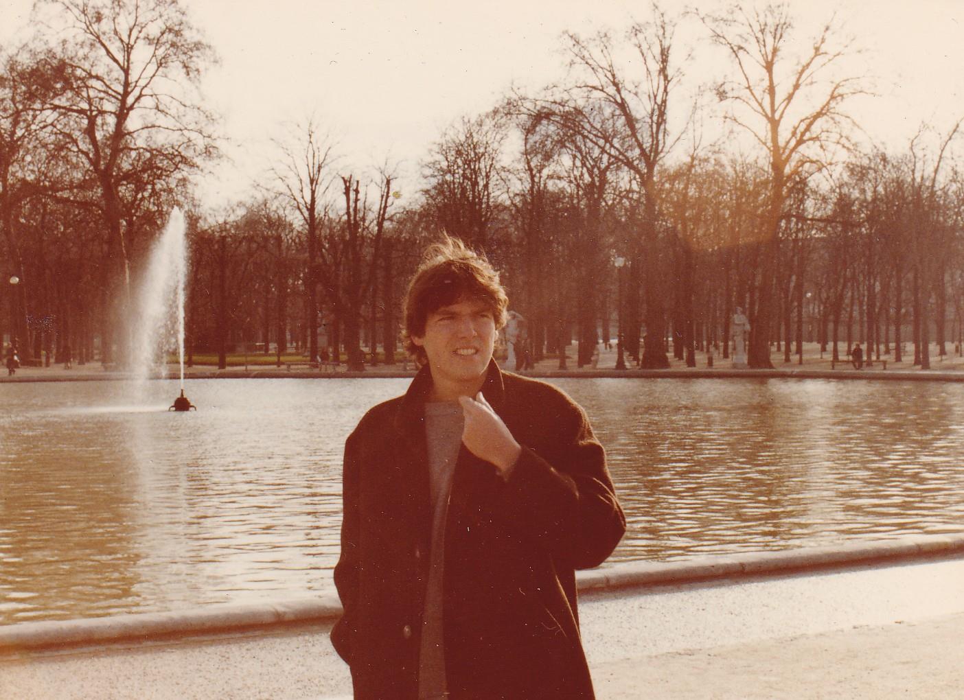 A man standing in front of a fountain