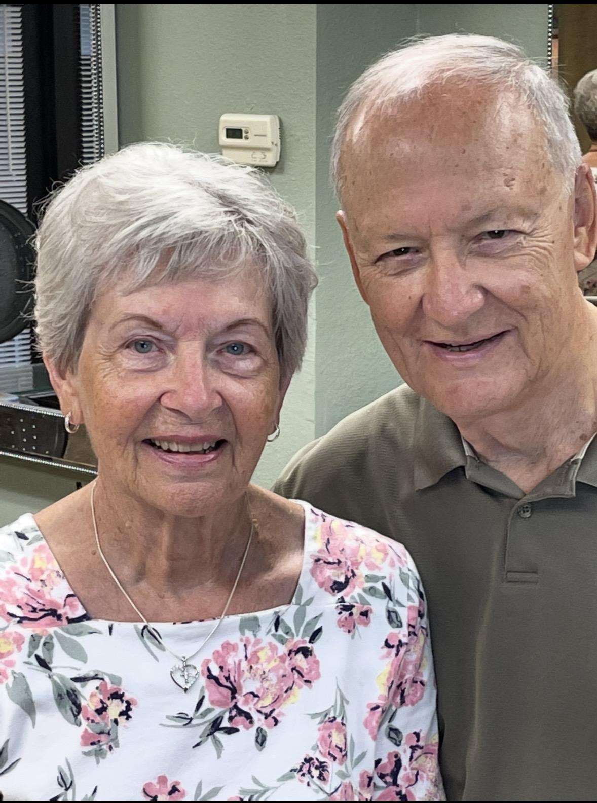 A man and woman smiling for a picture