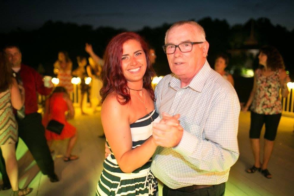 A man and woman dancing at night