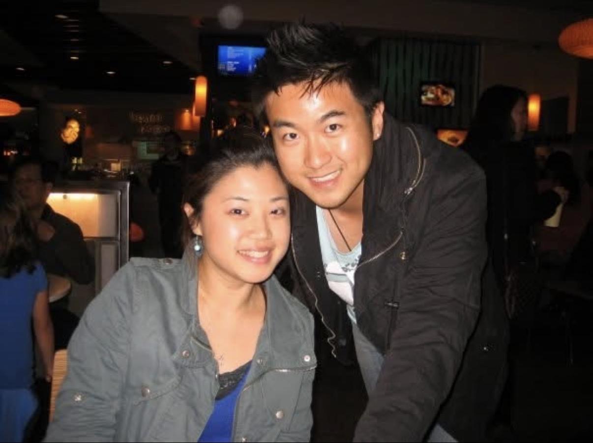 A man and woman posing for a picture