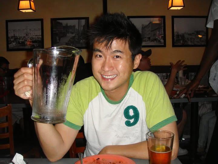 A man holding a glass pitcher