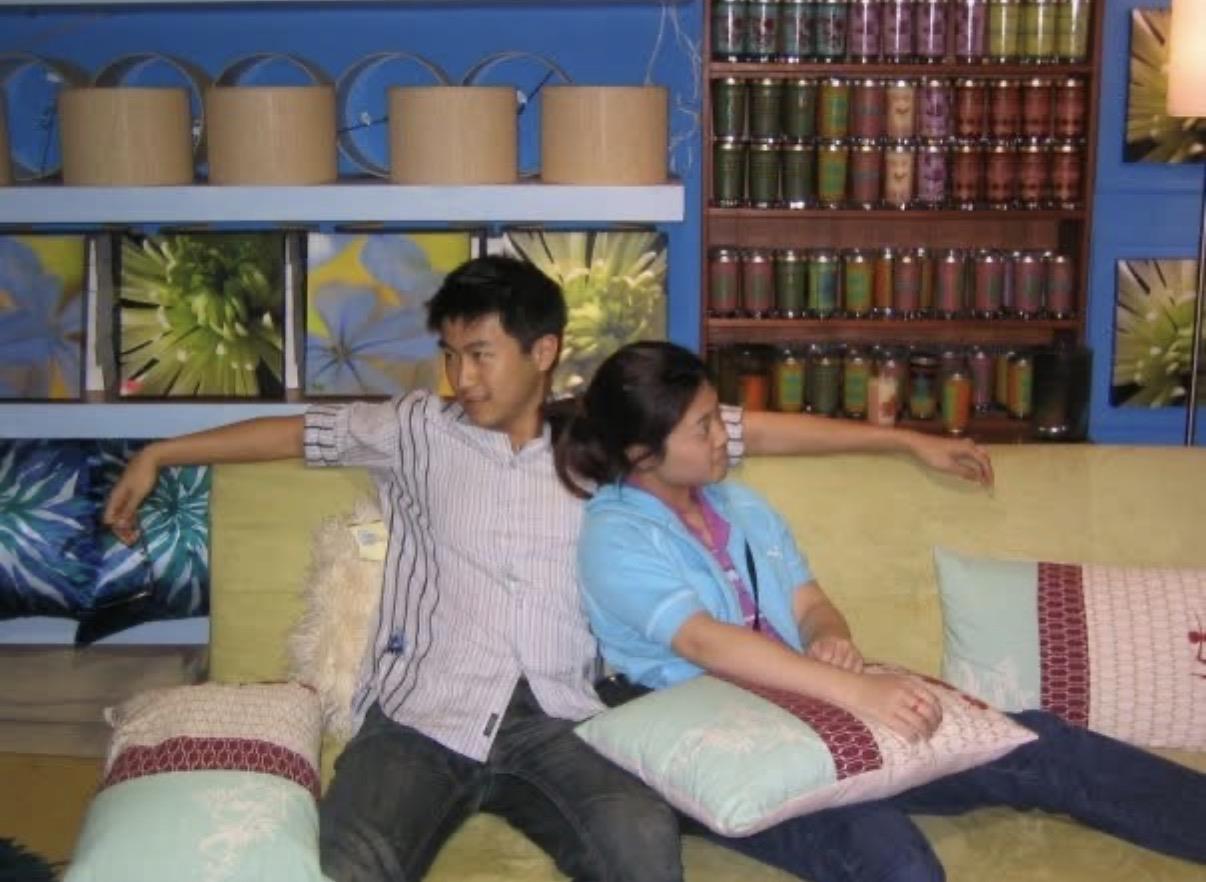 A man and woman sitting on a couch