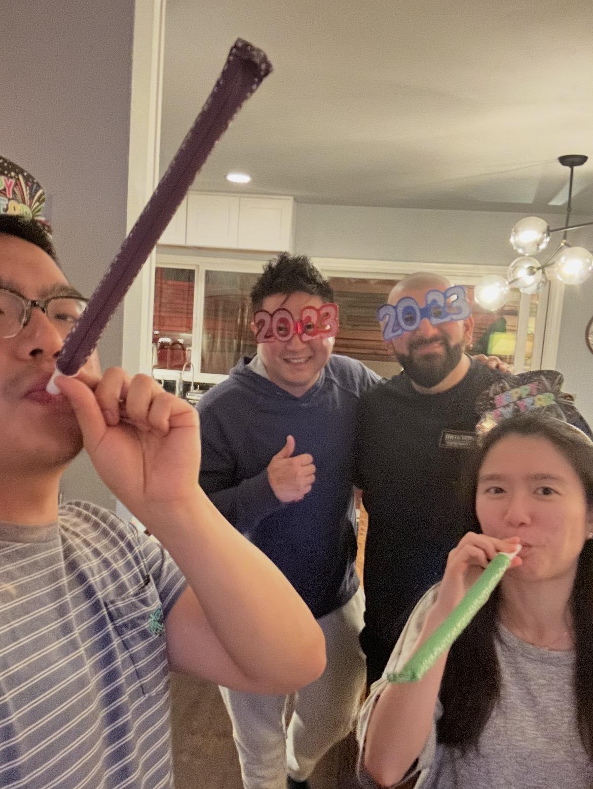 A group of people in a room with party straws