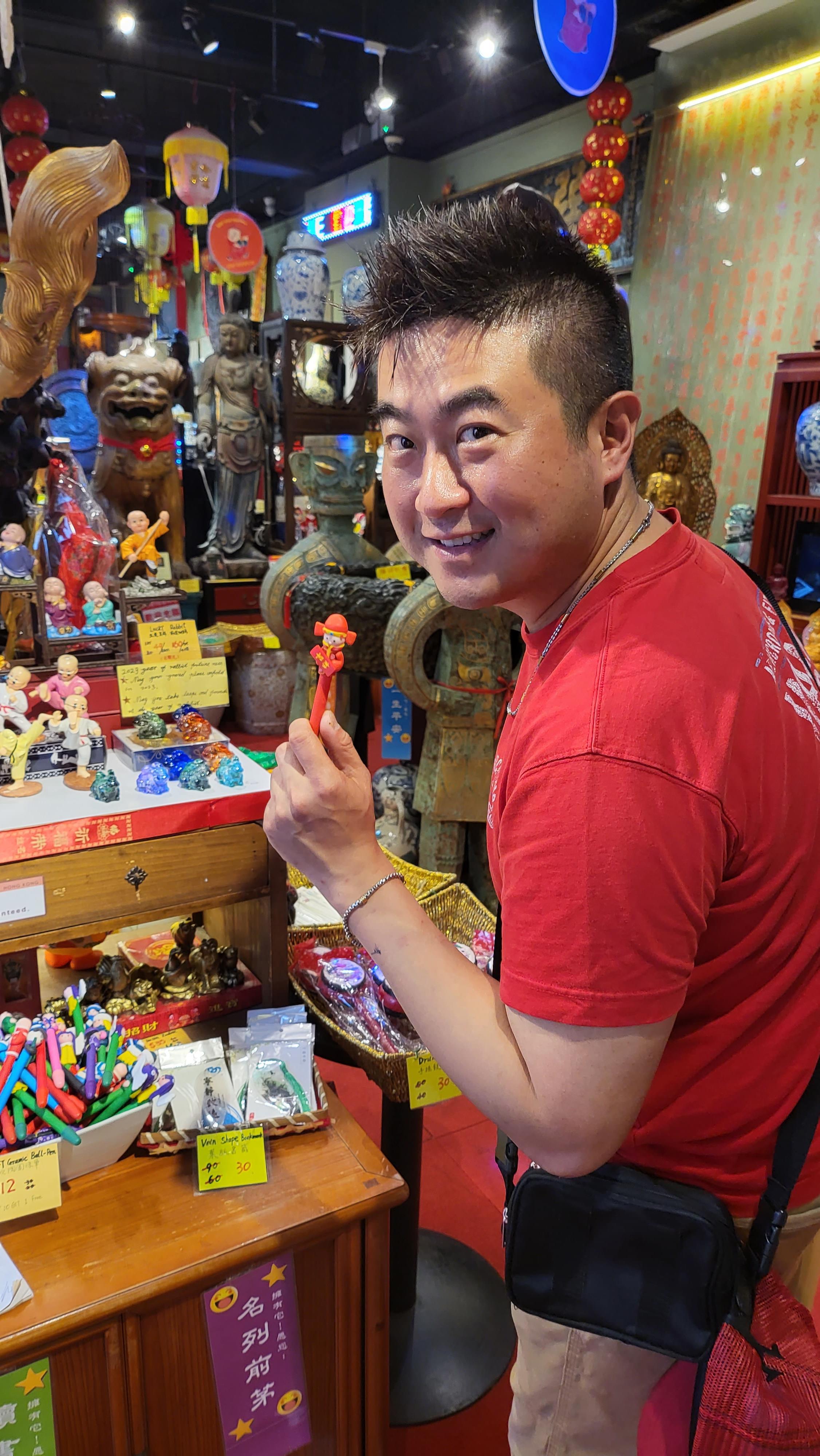 A man holding a small figurine