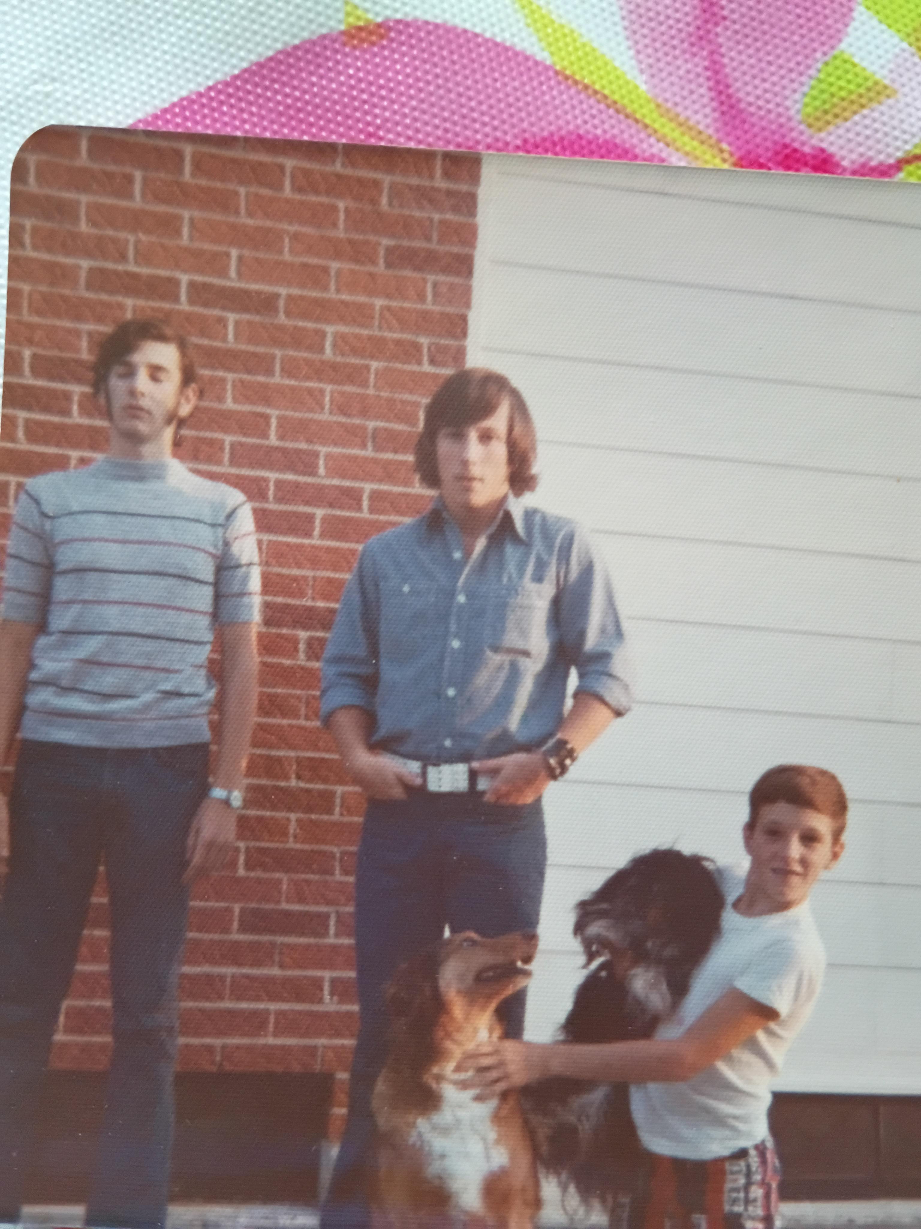 A group of men with a dog