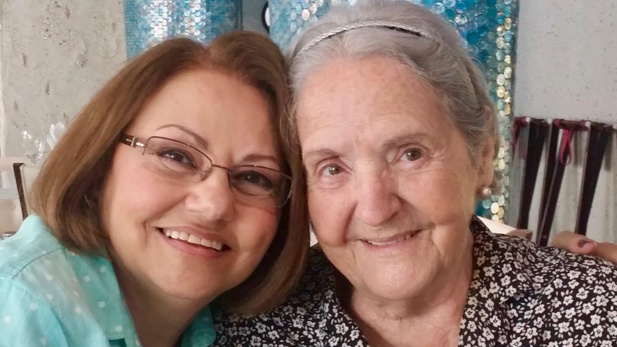 Two women smiling at the camera