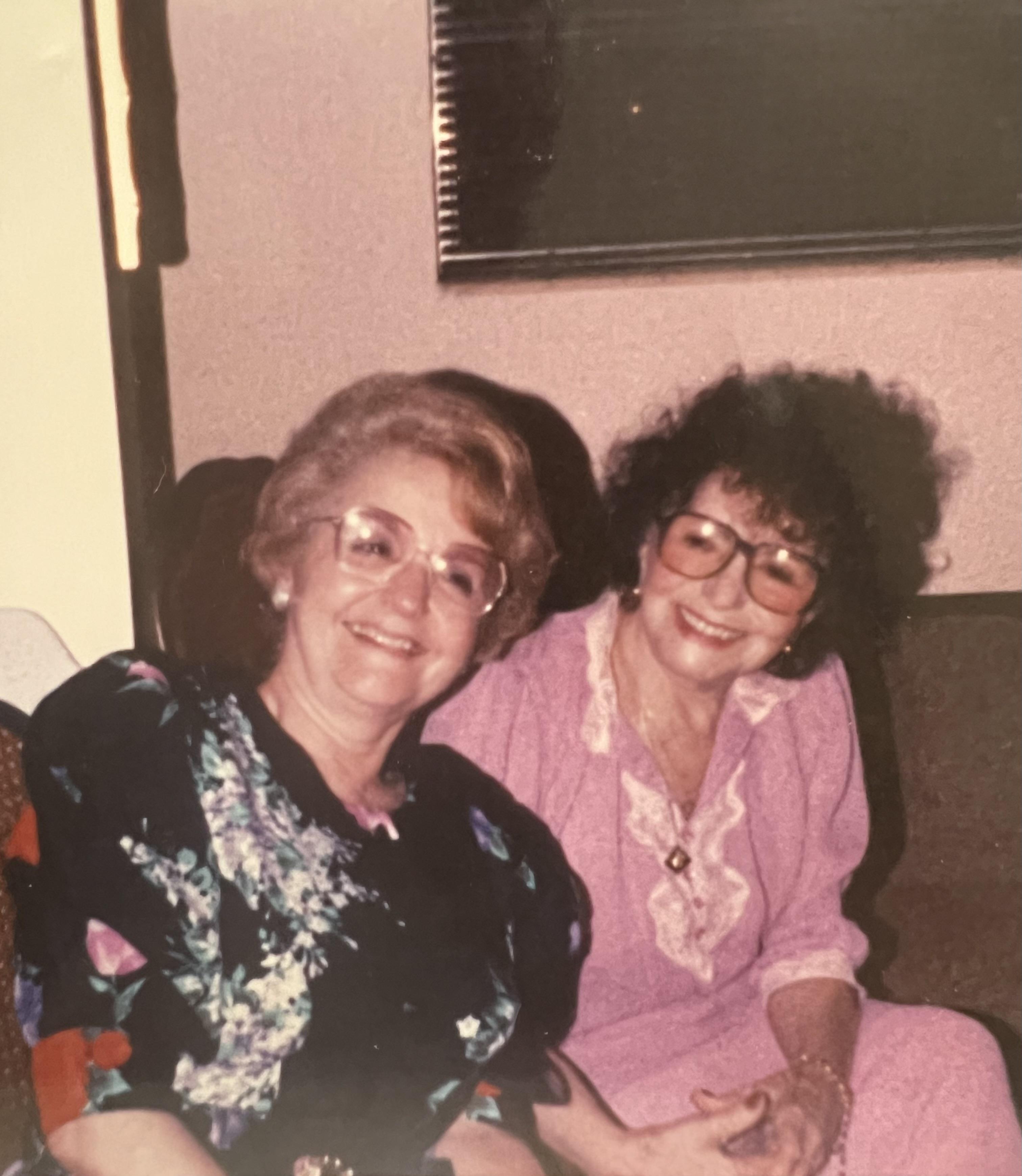 Two women sitting on a couch