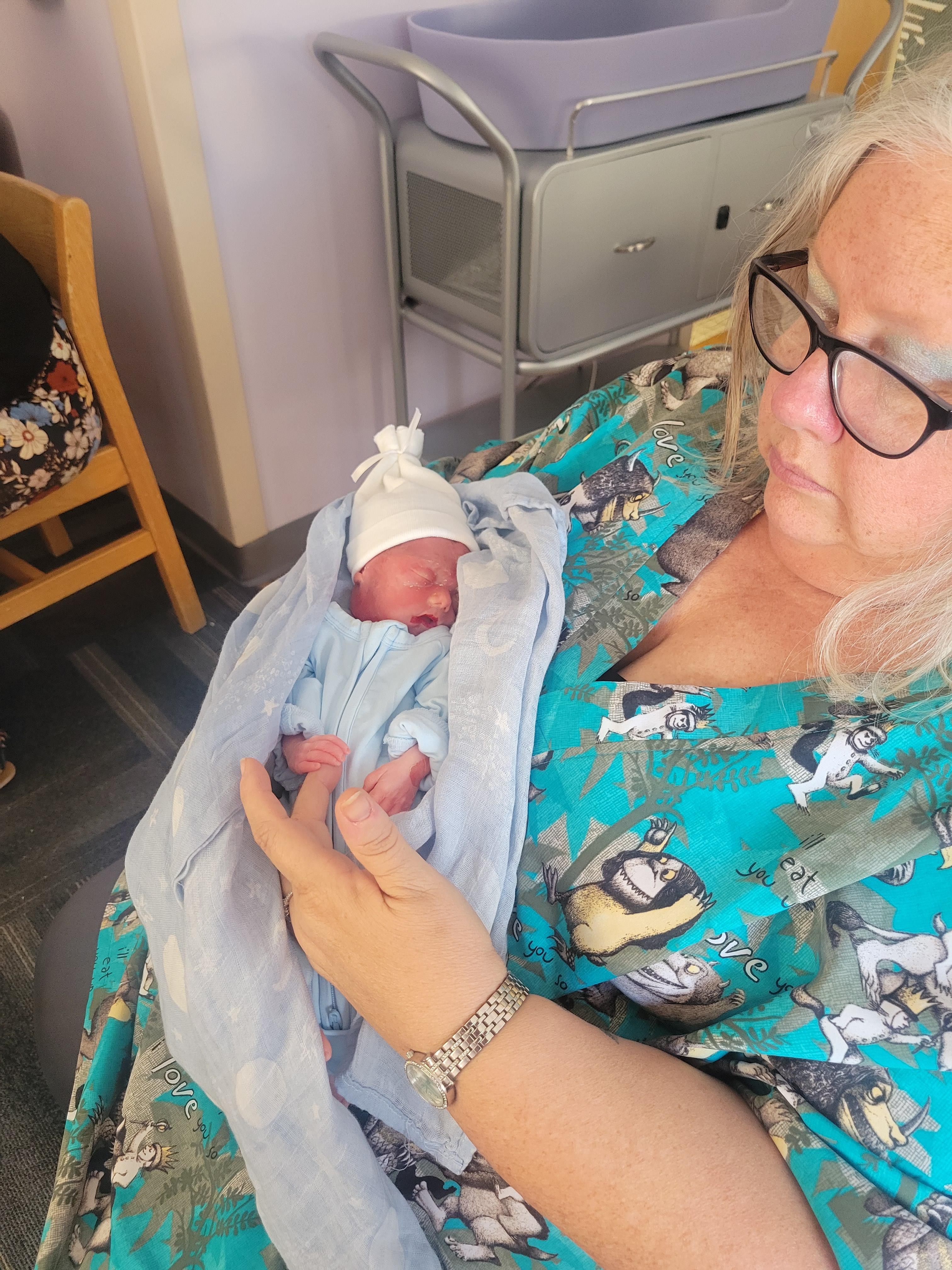 A woman holding a baby