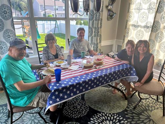 A group of people sitting at a table