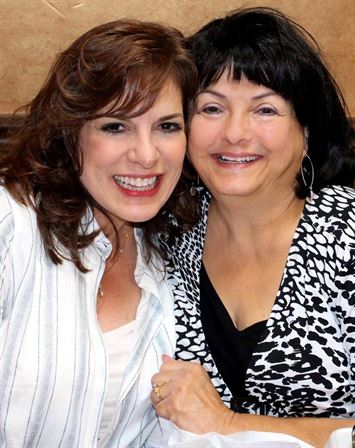 Two women smiling at the camera