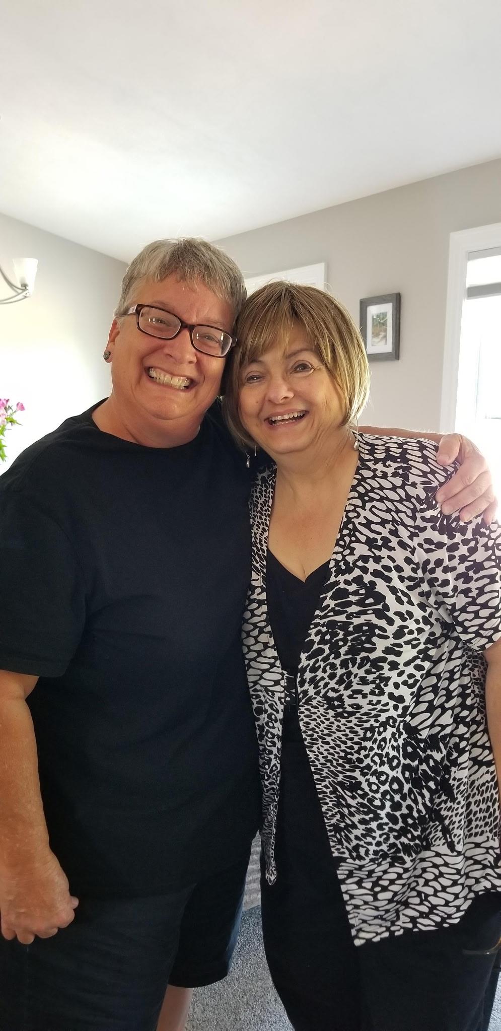 A man and woman smiling