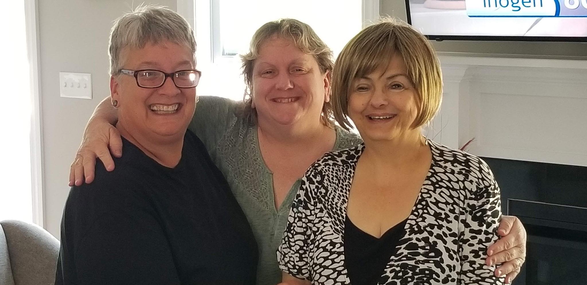 A group of women smiling for a photo