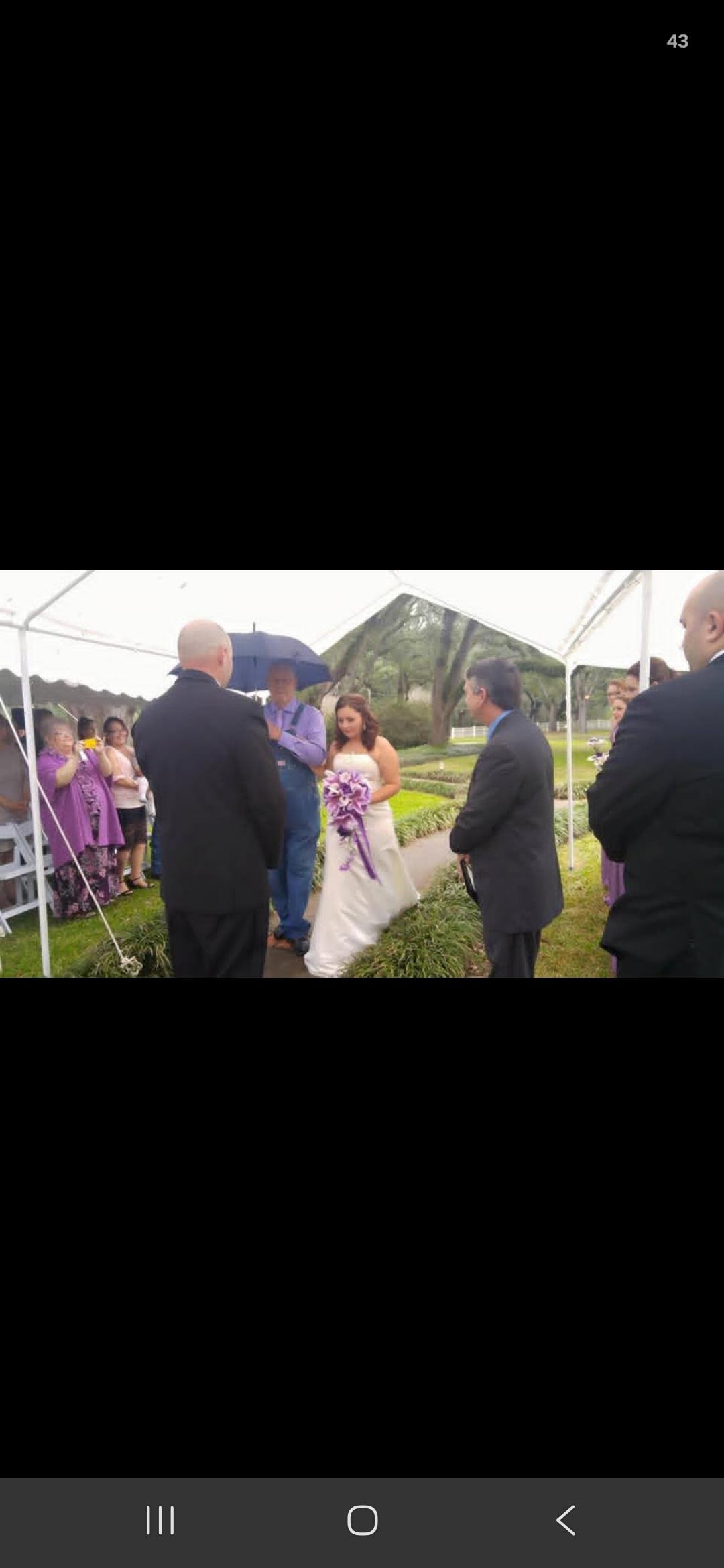 A bride and groom under a tent