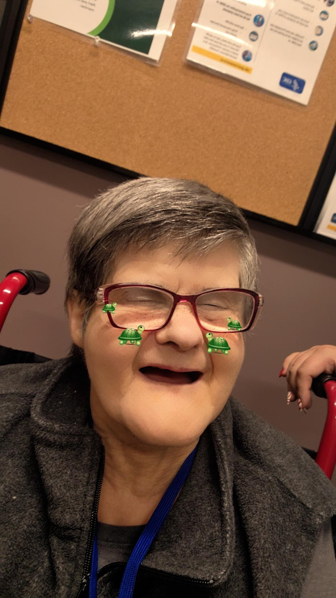 A woman with glasses and a turtle on her face