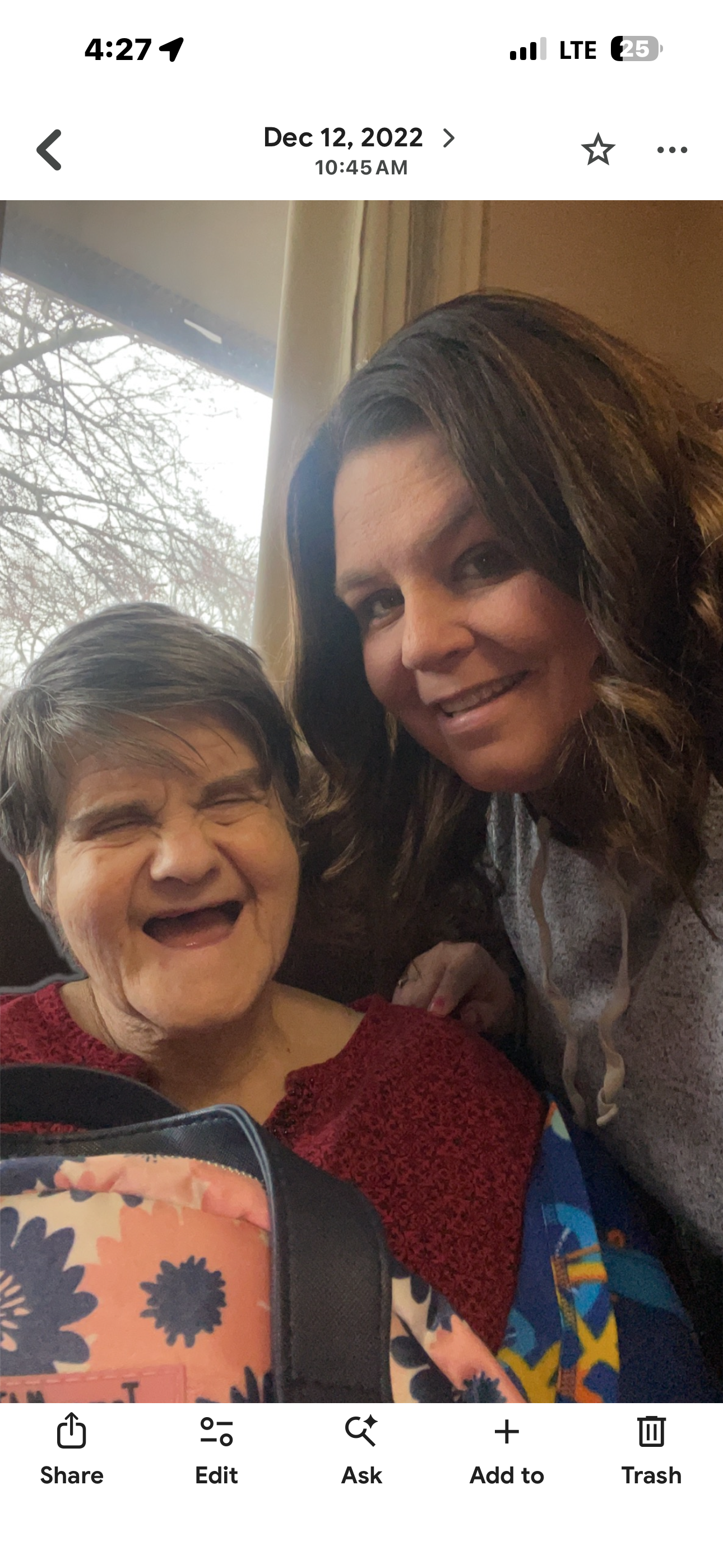 A woman taking a selfie with another woman