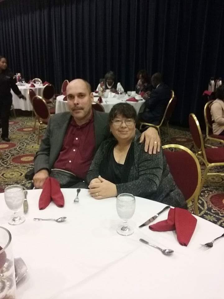 A man and woman sitting at a table