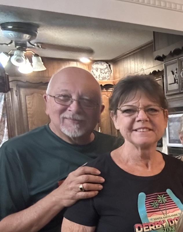 A man and woman posing for a picture