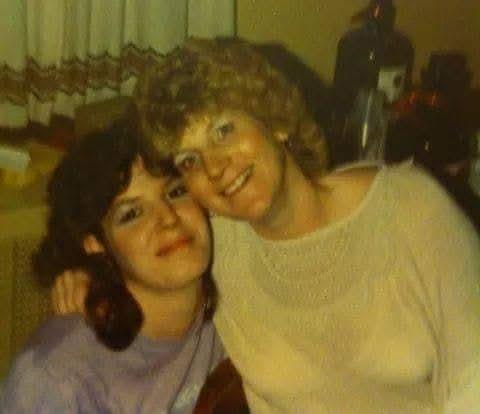 A couple of women posing for a picture