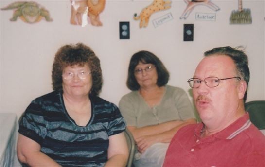 A group of people sitting in a room