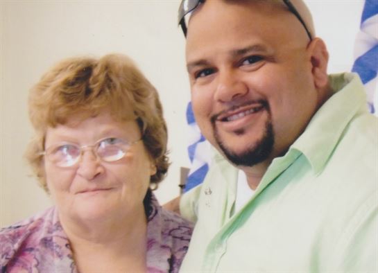 A man and woman posing for a picture