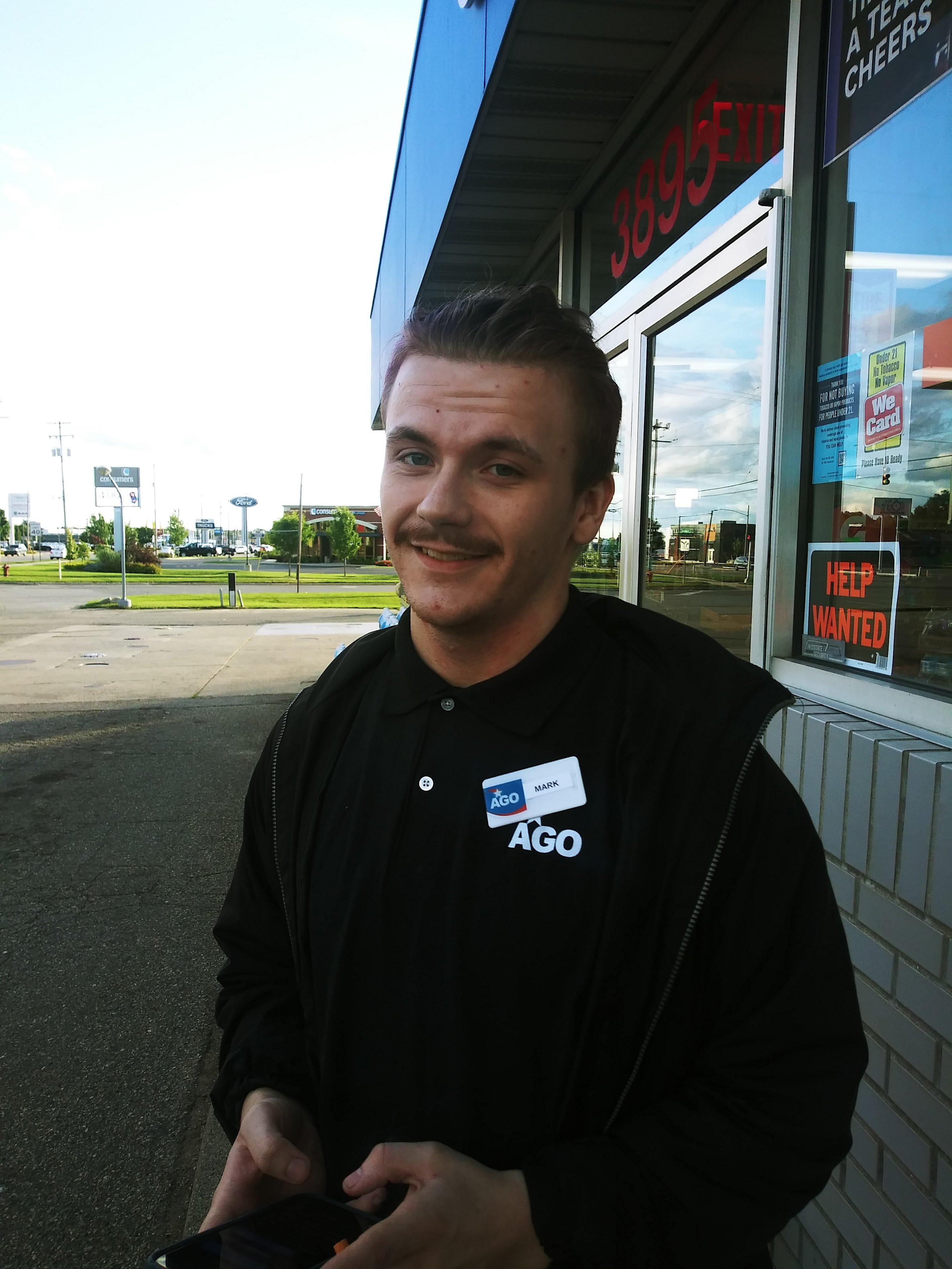 A man standing outside a store