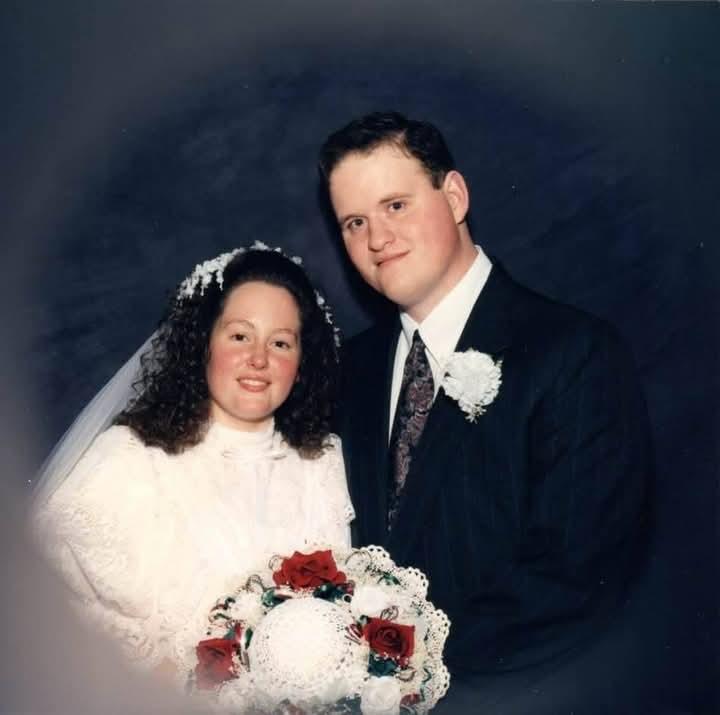A man and woman posing for a picture