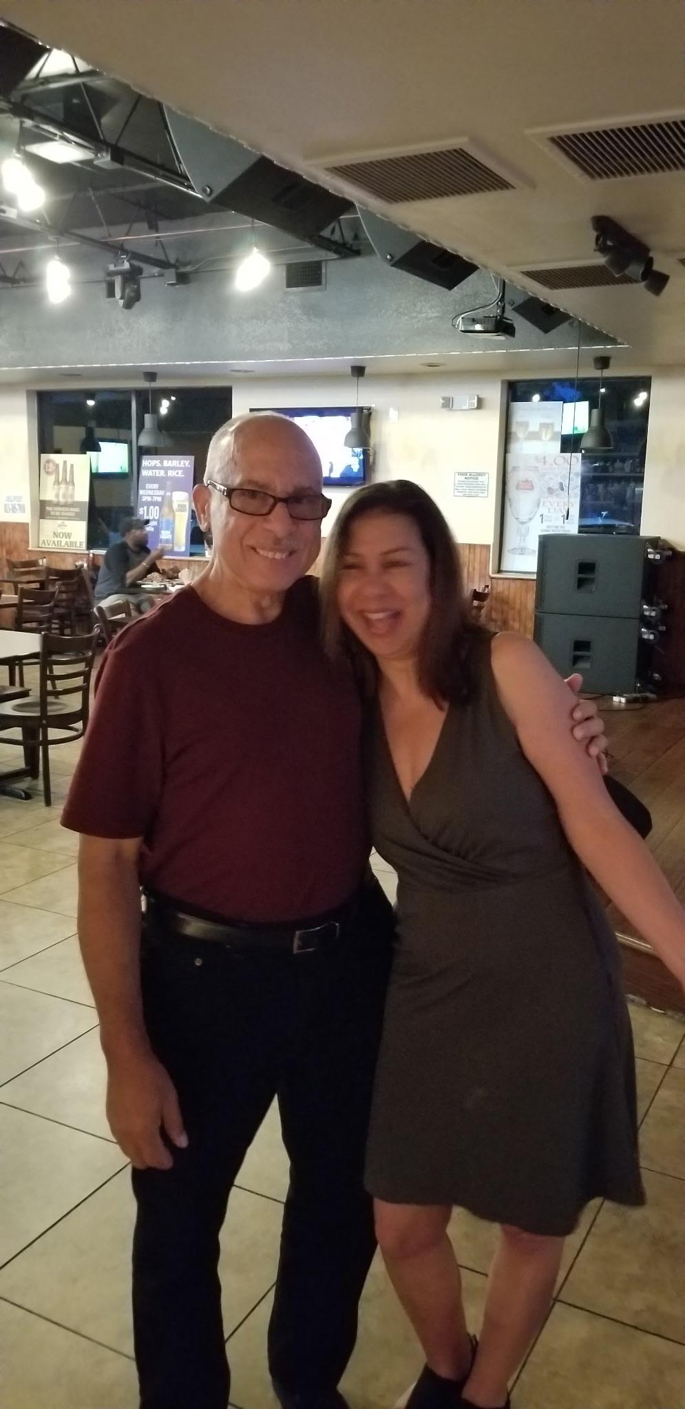 A man and woman posing for a picture