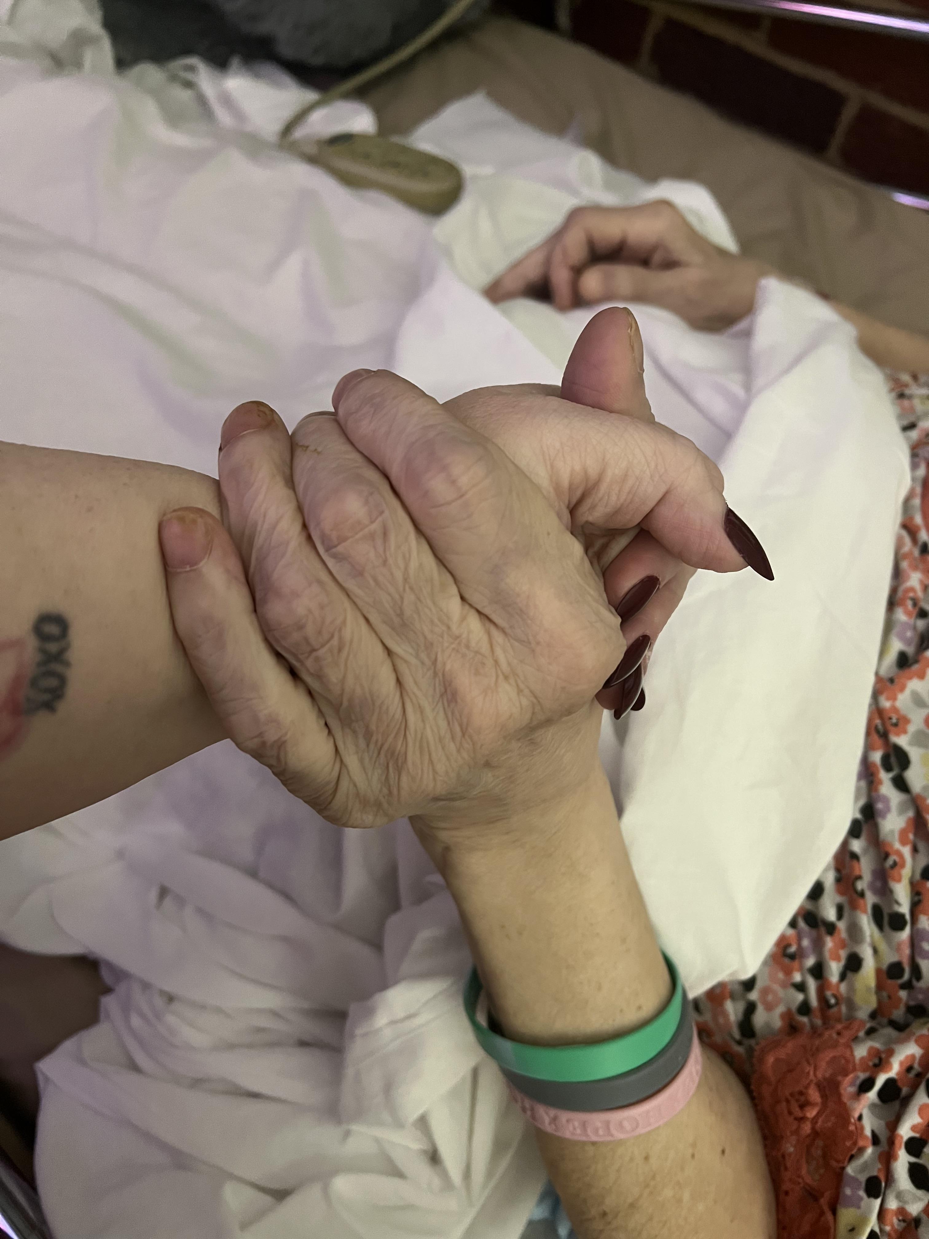A person holding another person's hand
