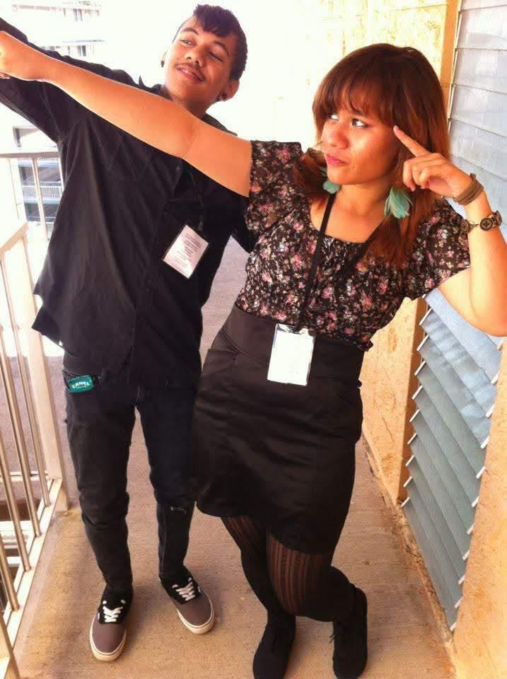 A man and woman posing for a picture
