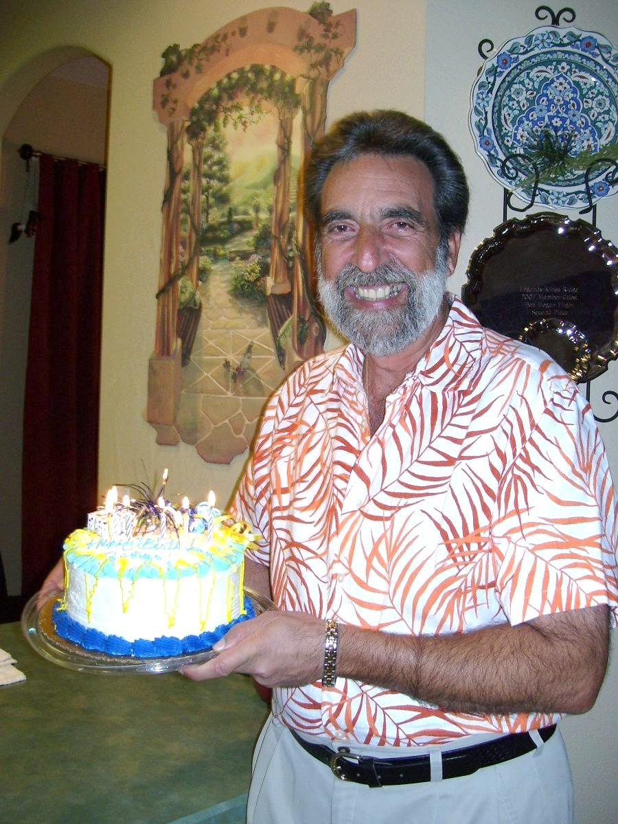 A man holding a cake