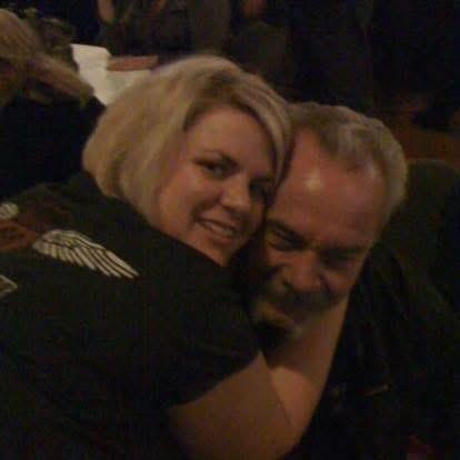 A man and woman hugging