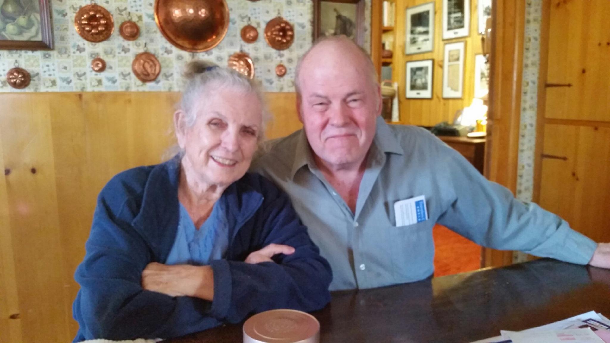 A man and woman sitting at a table