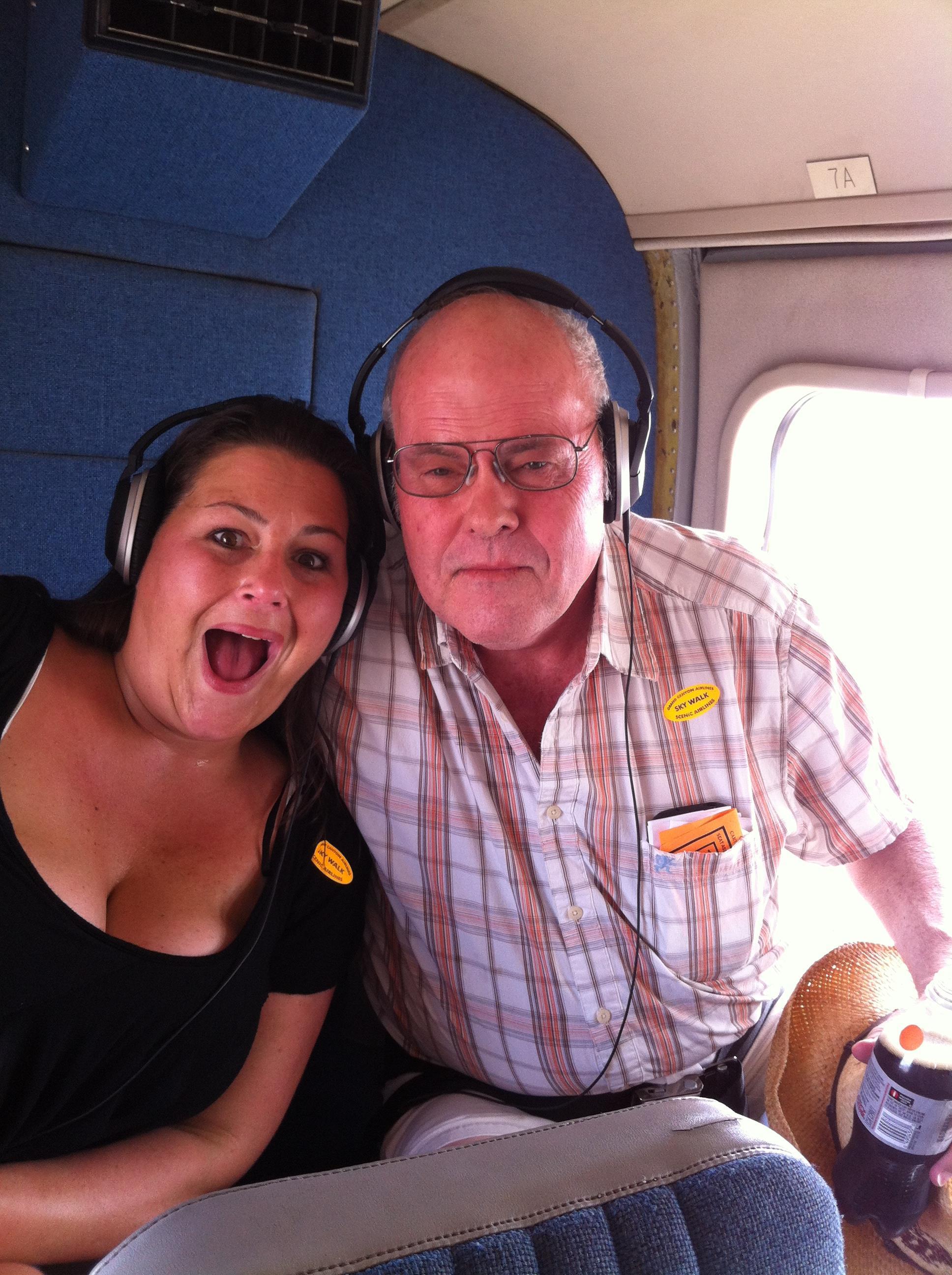 A man and woman sitting in a plane