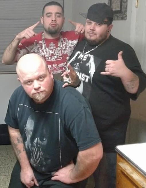 A group of men posing for a picture