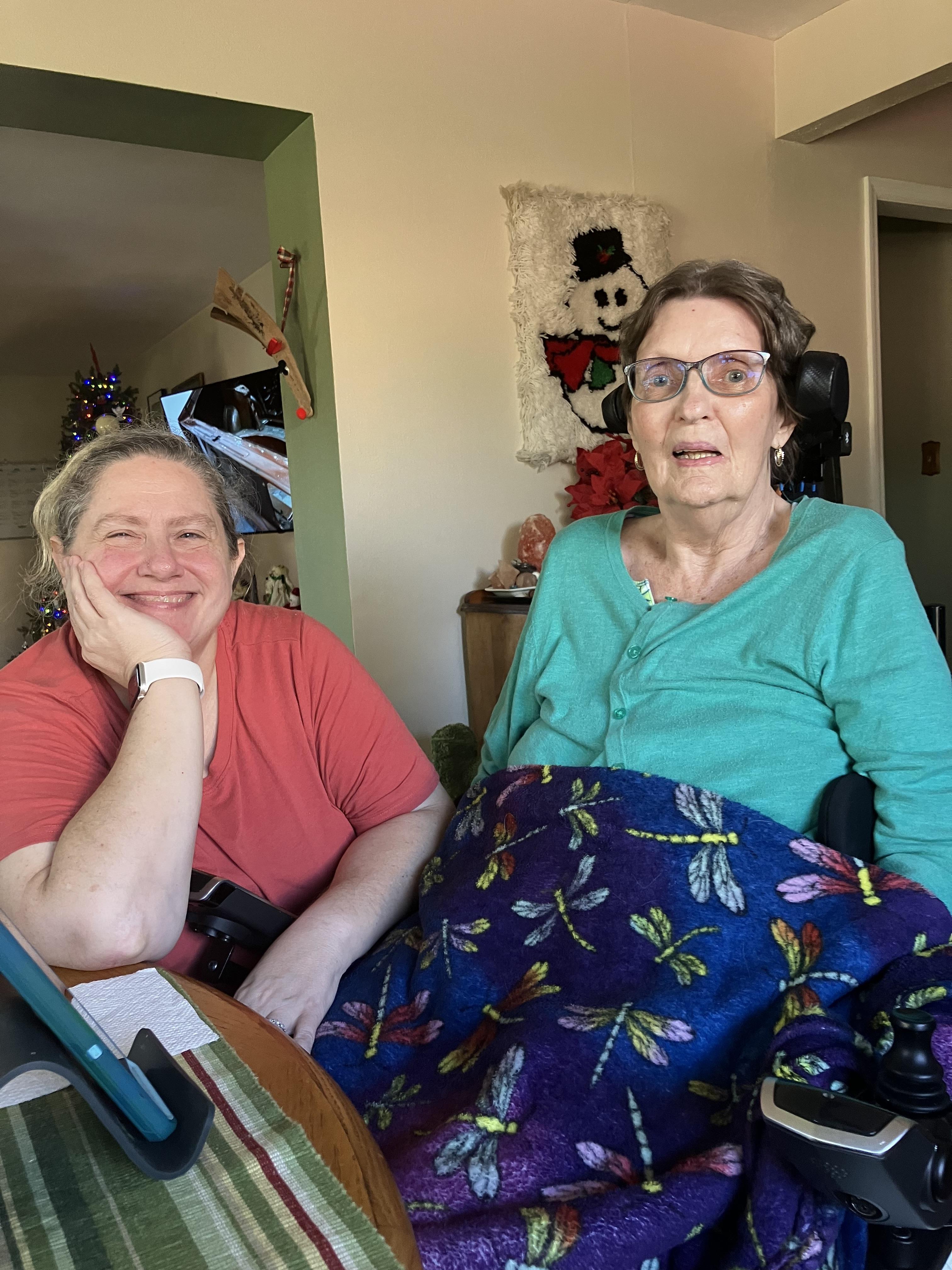 Two women sitting in a chair