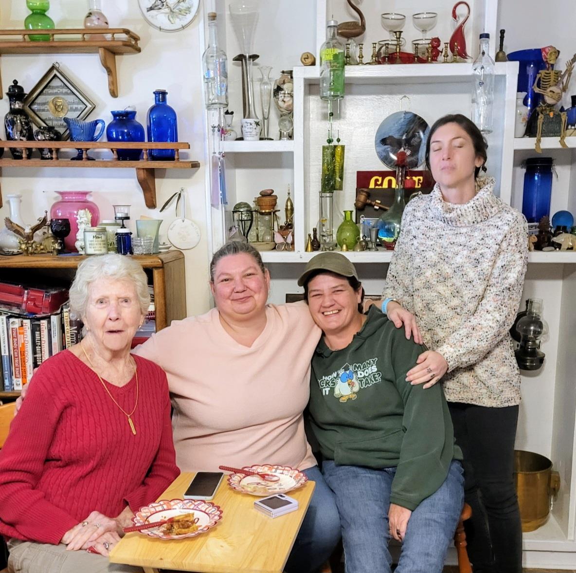 A group of women sitting together smiling