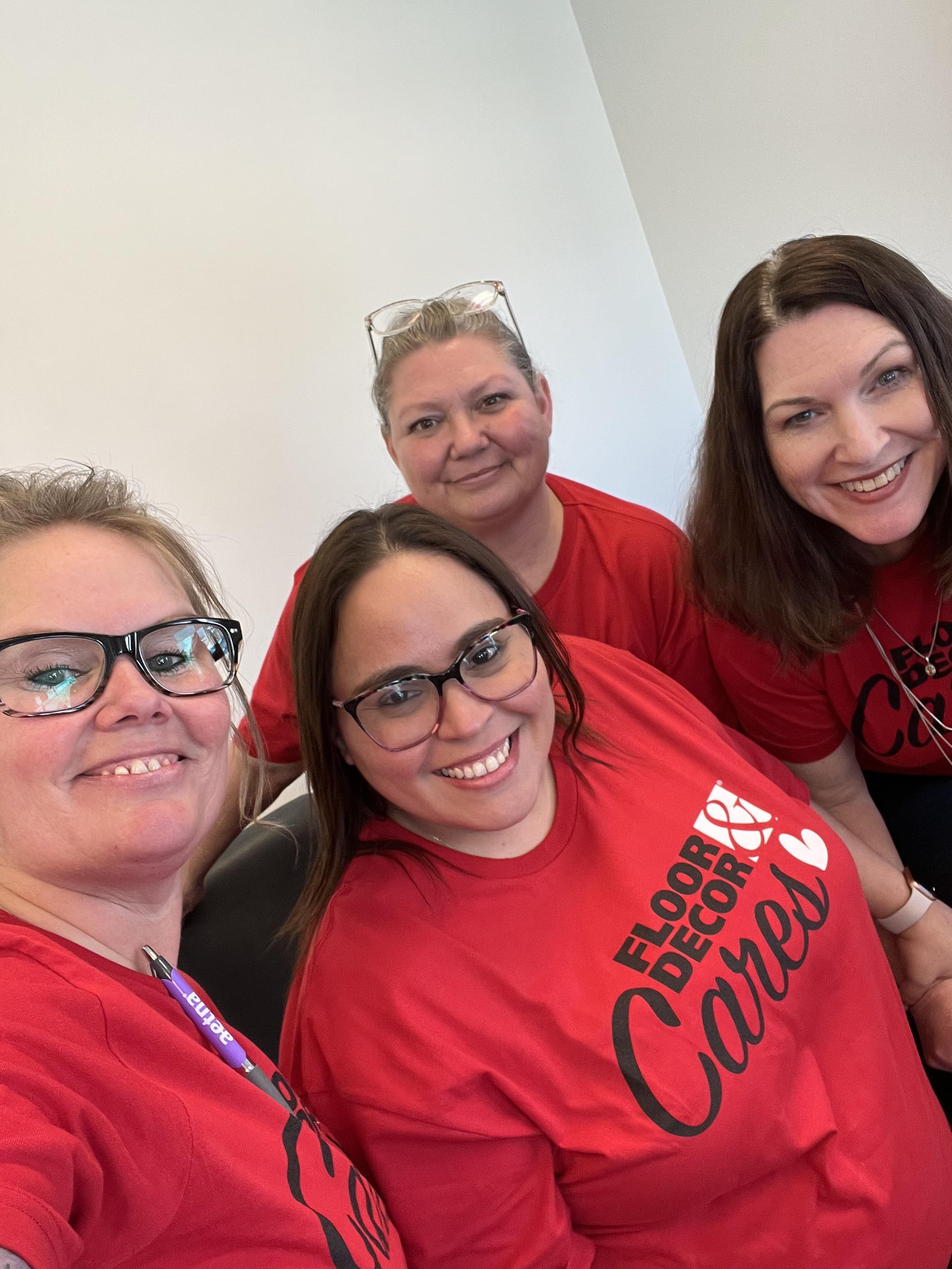 A group of women wearing red shirts