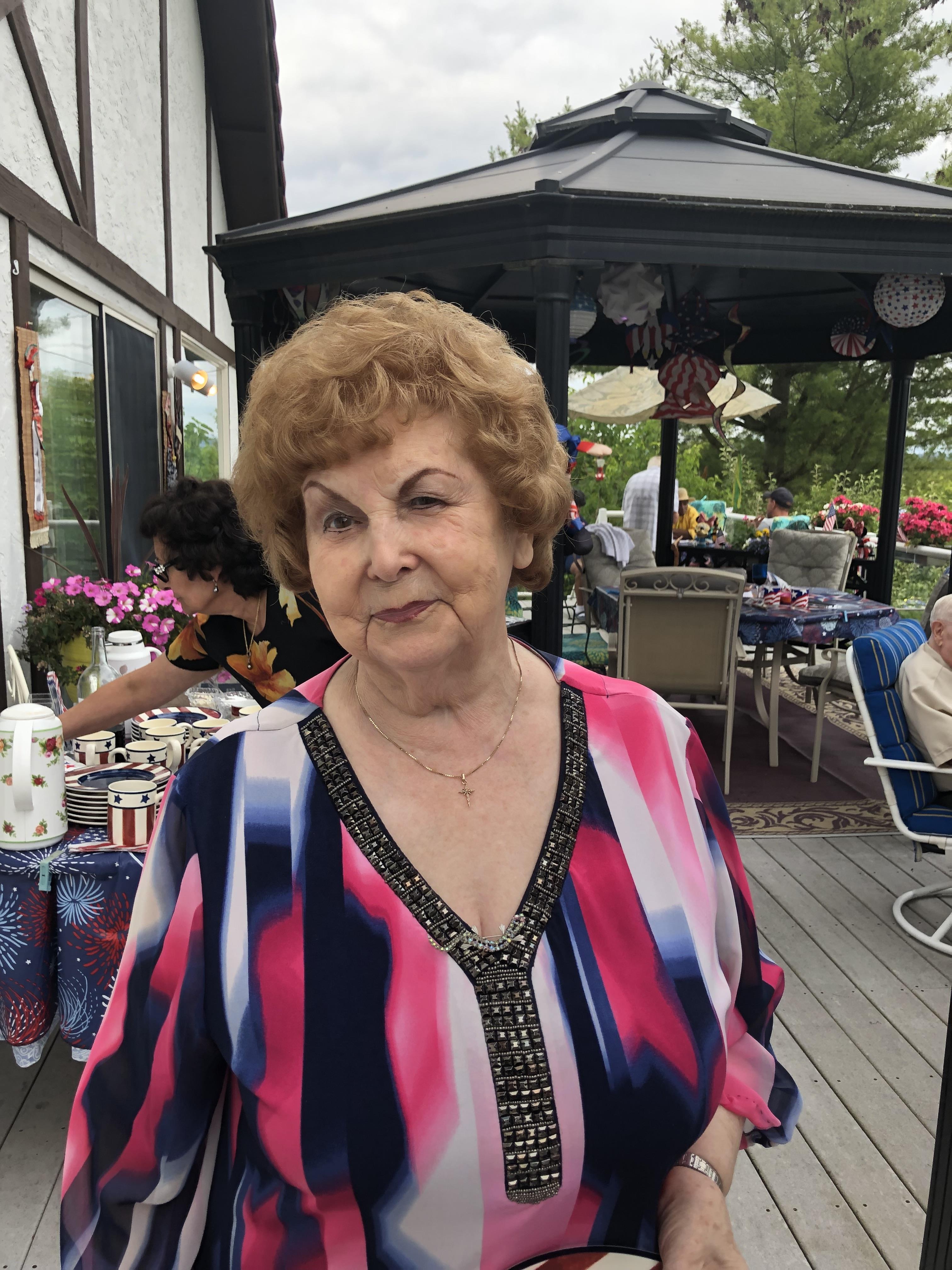 A woman standing outside on a patio