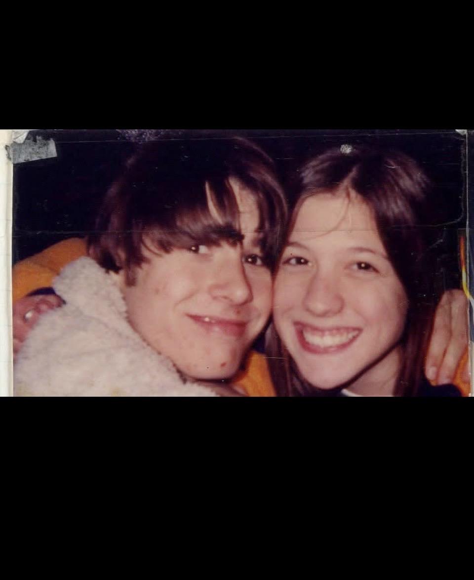A man and woman smiling for a picture