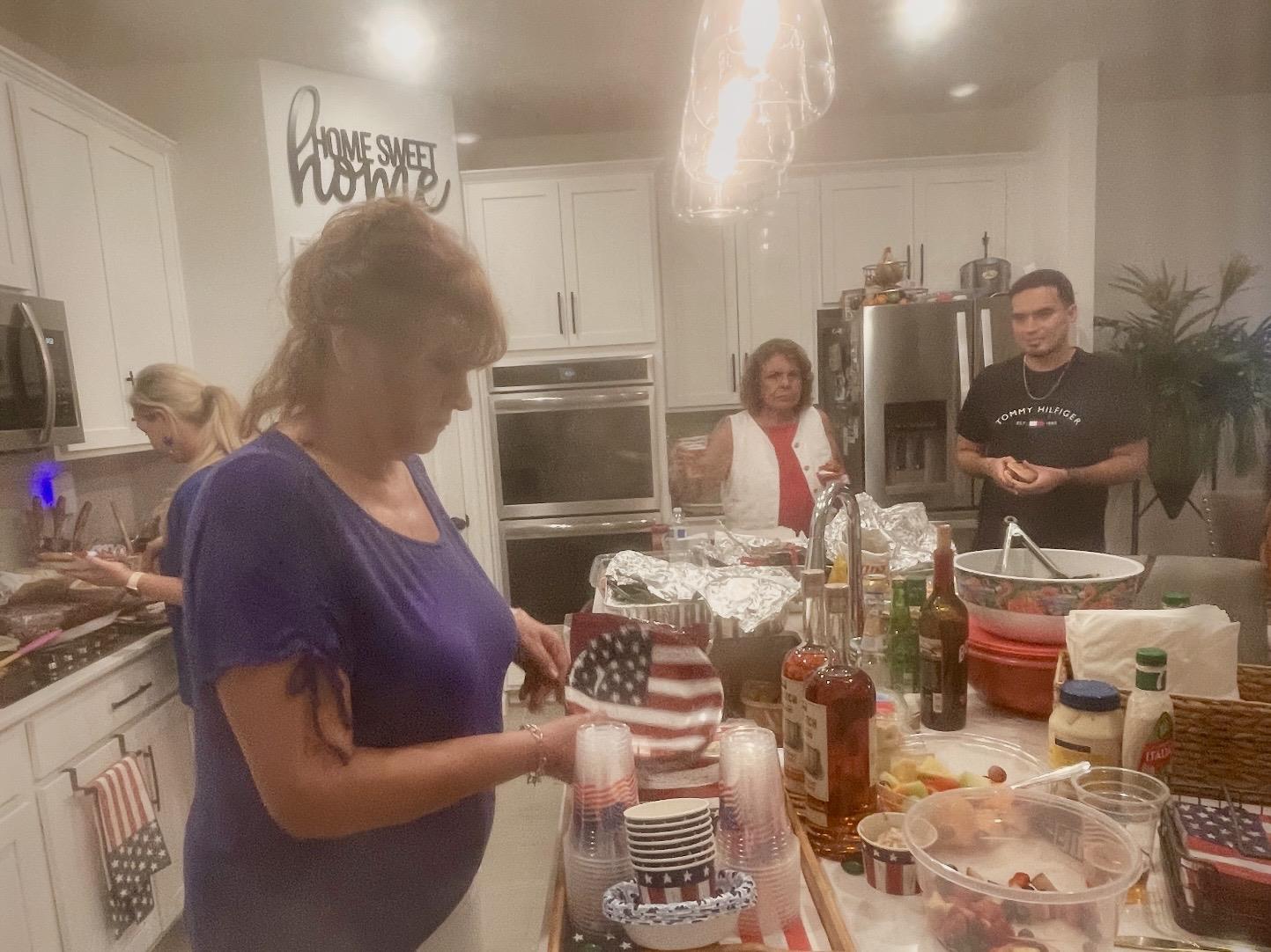 A group of people in a kitchen