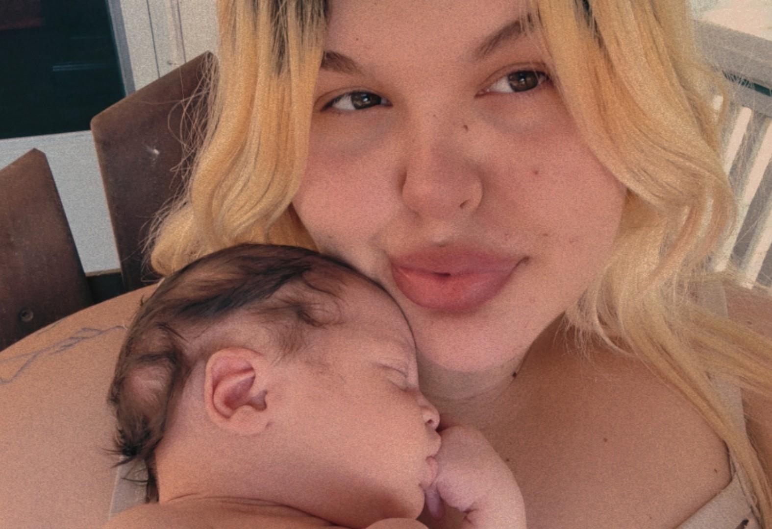 A woman holding a baby