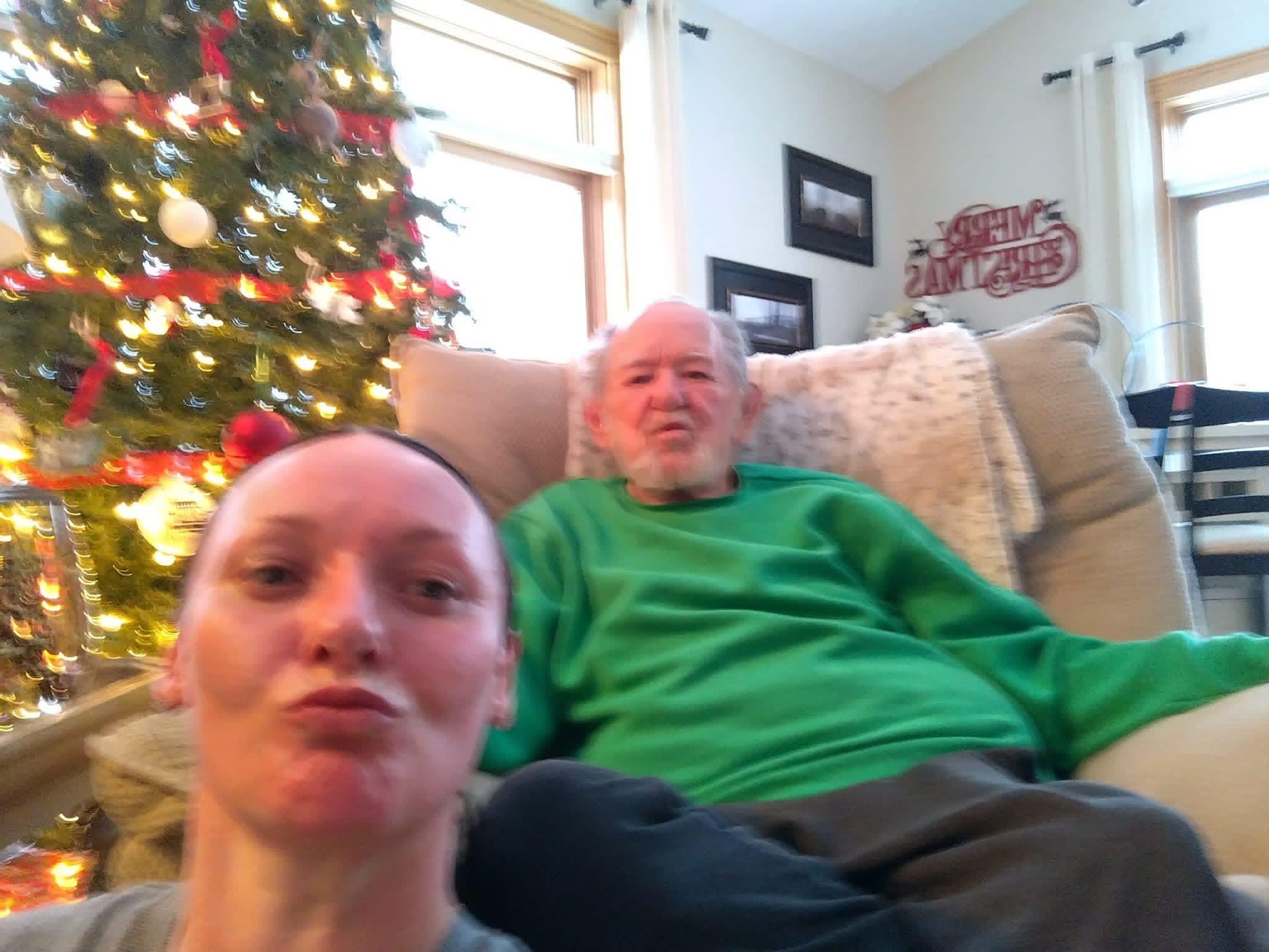 A woman and man sitting on a couch