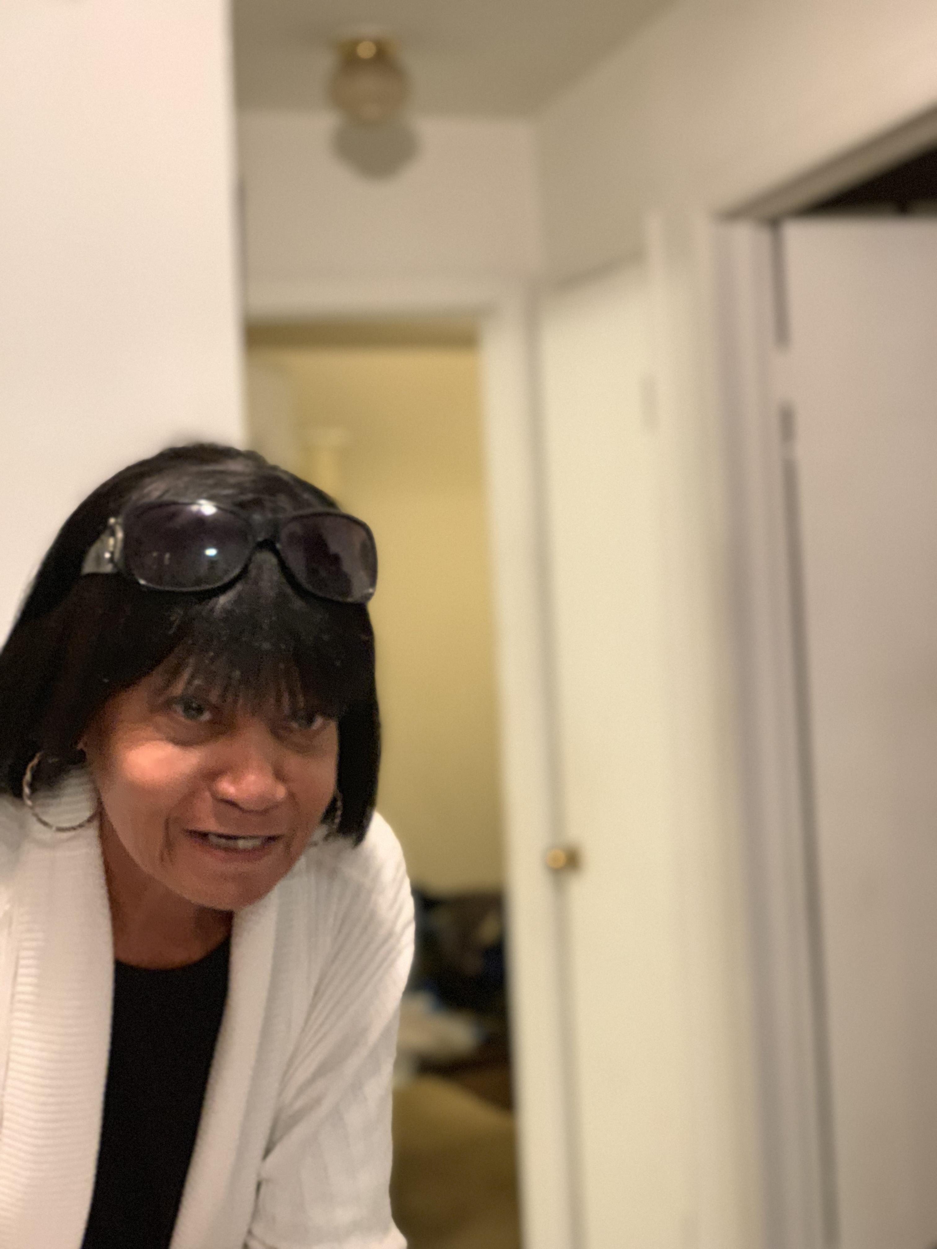 A woman with sunglasses on her head