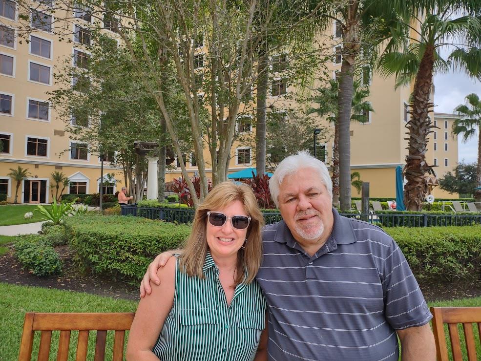 A man and woman sitting on a bench