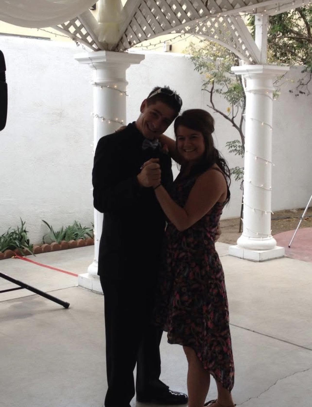 A man and woman posing for a picture