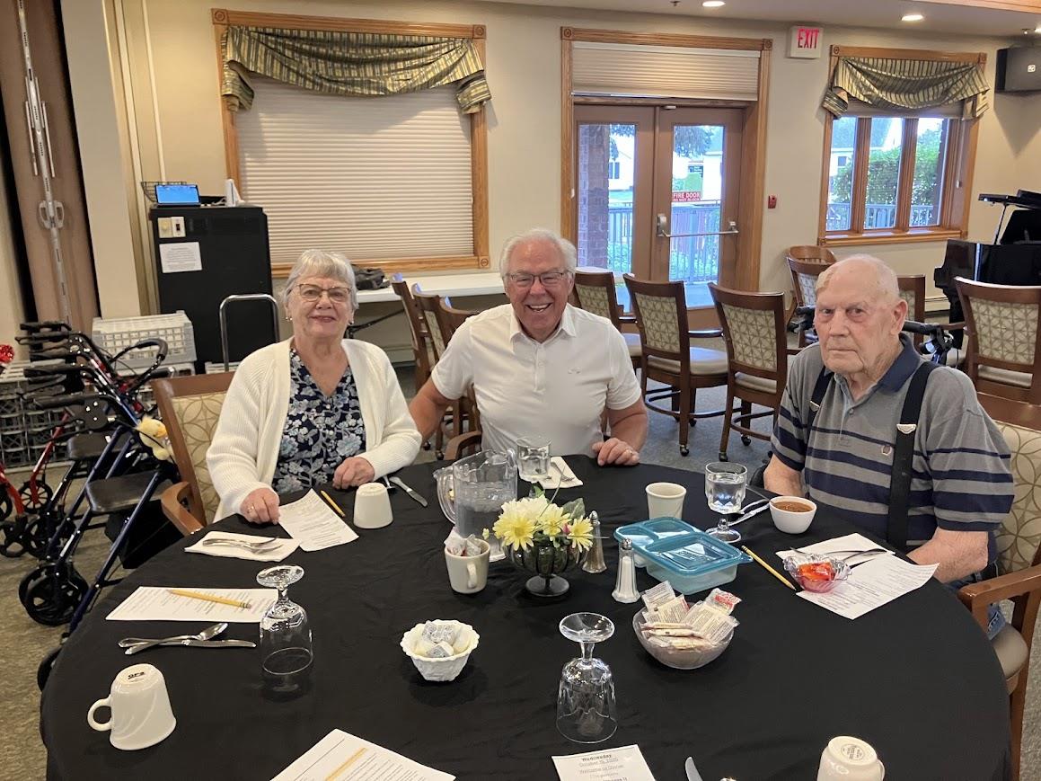 A group of people sitting at a table
