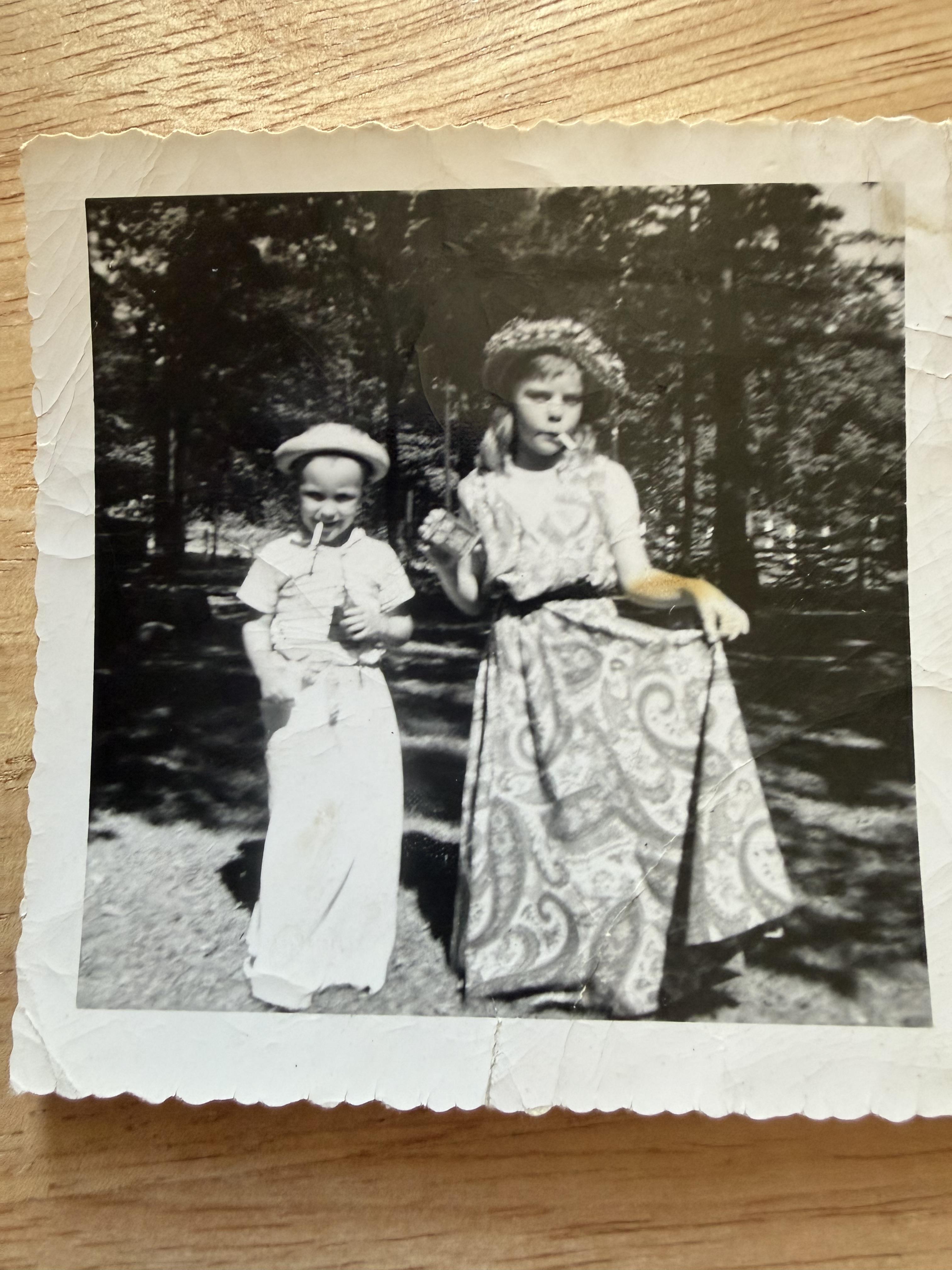 A black and white photo of two girls